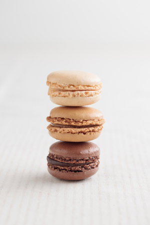 Colorful pastel eco handmade natural macaroons on white background. Gift for 8 March, International Women's Day, Valentine's Day. vertical stackの写真素材
