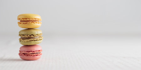 Colorful pastel eco handmade natural macaroons on white background. Gift for 8 March, International Women's Day, Valentine's Day. Horizontal banner closeup with a copyspaceの写真素材