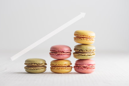 Colorful macaroons on white background, increase in profits of the confectionery production horizontal bannerの写真素材