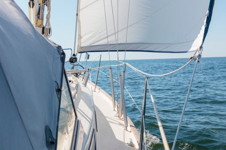 Luxury cruise on a sailing rigged yacht under a genoa sailing in a light wind during the regatta....