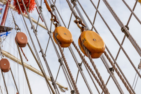 Sailing ship lines, pulleys and securing equipment tied down for the day. Deck and ropes, rigging on...