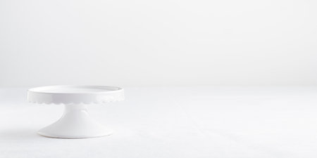 Empty tableware - white plate cakestand on white table as a background for a dessert horizontal banner photo with a copy space, food mokupの写真素材