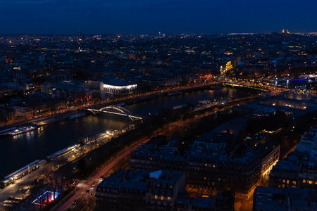 Paris city panorama with Pont Debilly Footbridge, the aerial view from the Eiffel tower in night illumination.の写真素材