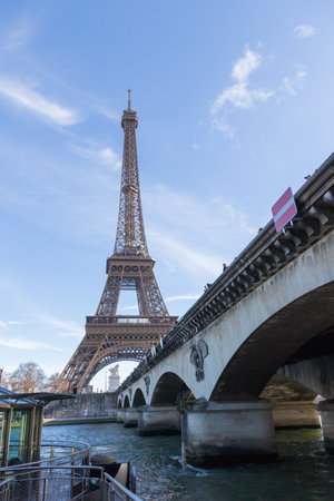 Paris, France - February 23, 2025: Eiffel Tower at Pont d'Lena Bridge on the Seine River in Paris, France in early springの写真素材