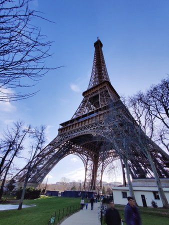 Paris, France - February 23, 2025: Eiffel Tower from low angle in early spring.の写真素材
