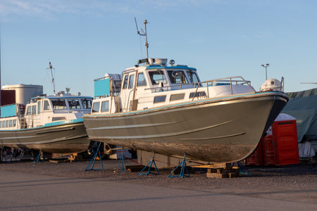 Ferry boat stored out of the water for the winter, winter storage for the boat in Finland, Suomenoja, winterizing , short season in Northern country, cold conditionsの写真素材