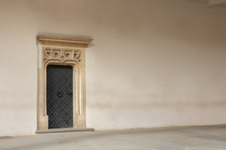 An old door on old residential house in historical building in Krakow, Poland. A textured surface of beautiful architectureの写真素材