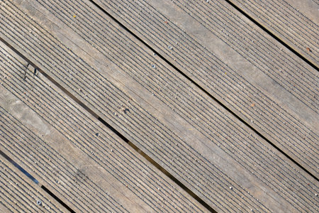 An wooden deck, old terrace need to clean and restore. Texture of old natural gray weathered wooden boards surface, banner with deckの写真素材