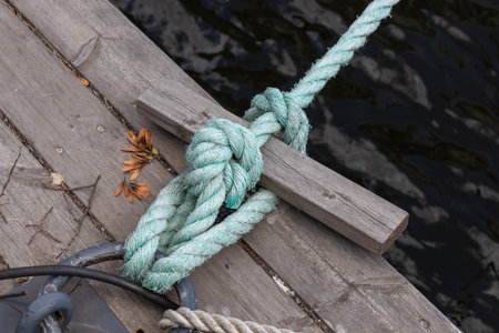 Close-up of a bowline knot securing a boat with mooring ropes. A strong and reliable nautical knot...