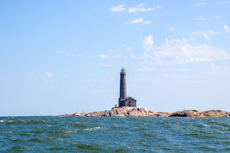 Bengtskar Lighthouse near Hanko, Finland. Tallest lighthouse in Scandinavia, rising above Baltic Sea, surrounded by rocky islands. Historic maritime landmark and popular tourist destinationの写真素材