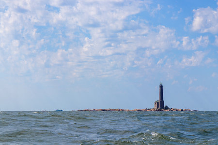 Bengtskar Lighthouse near Hanko, Finland. Tallest lighthouse in Scandinavia, rising above Baltic Sea, surrounded by rocky islands. Historic maritime landmark and popular tourist destinationの写真素材