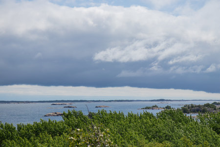 Scenic view of the Baltic Sea, concept of eco-tourism, travelling. Clean waters, natural coastline, and sustainable travel harmony with Finnish nature, marine environmentの写真素材