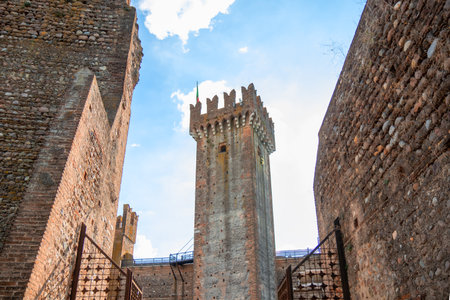 Towers of ancient castle in Borghetto, Italy - a medieval fortress above the village, featuring stone walls, towers, and historic architectureの写真素材