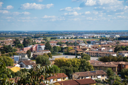 Aerial view of Borghetto, Italy - a picturesque medieval village on the Mincio River, showcasing stone buildings, bridges, narrow streets, and the surrounding scenic countrysideの写真素材