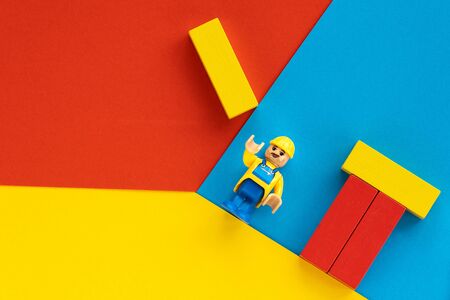 Milan, Italy - August 11 2019: Lego toy of engineer construction worker with helmet building a...