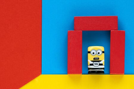 Milan, Italy - August 11 2019: Minion toy in prisoners clothes inside prison with shocked expression...