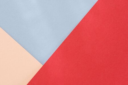 Red blue beige paper background. Geometric figures, shapes. Abstract geometric flat composition. Empty space on monochrome cardboardの写真素材