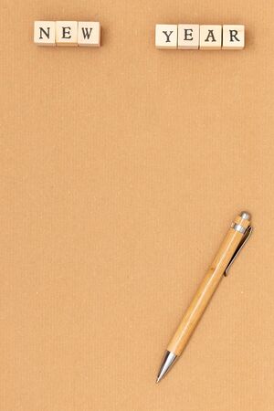 Blank empty craft sheet of paper, pen and christmas toy. Wish list or goals concept. Top view, flat lay, copy space.の写真素材