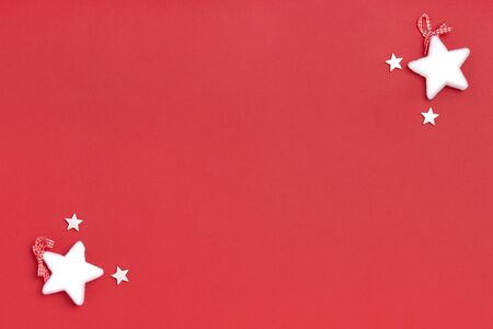 New Year and Christmas frame composition. Blank sheet of paper with christmas decorations on red...