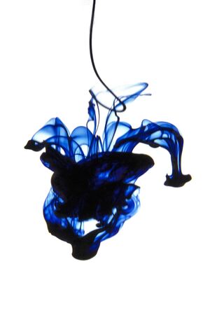 Acrylic colors and ink dropped in water. Abstract background. Isolated on whiteの写真素材