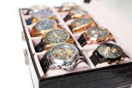 storage box with collection of men wrist watches