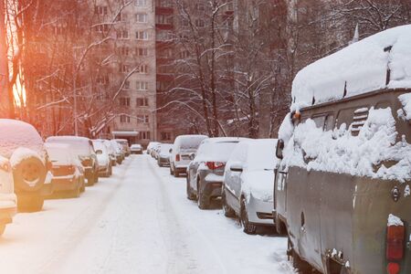 Cars covered with fresh white snowの写真素材