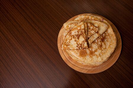 Thin pancakes with crispy crust. Maslenitsa. Pancakes for breakfast and carnival.