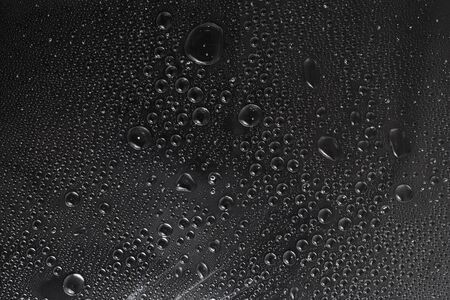 texture of water drops at dark backgroundの写真素材