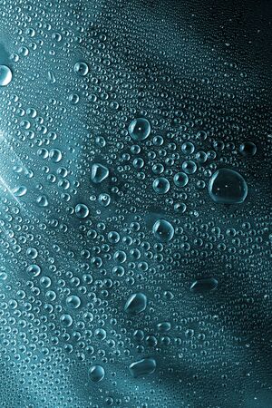 texture of water drops at dark backgroundの写真素材