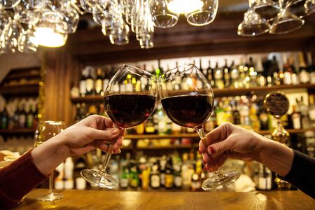 ladies is bar with red wineの写真素材
