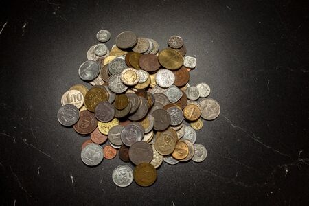 old coins collection at black backgroundの写真素材