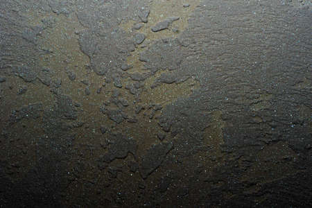 Gray wall stucco, concrete with abstract gold and green spots. Beautiful unusual texture or...