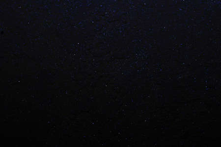 Abstract gorgeous bright dark blue background with multicolored glitter bokeh, similar to the night...