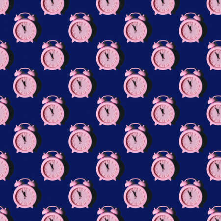 Seamless pattern with pink clocks on a dark blue background, repeating wallpaper with minimalistic seamless layout. New Year at midnight concept. Can be used as background, wrapper, textile elementの写真素材