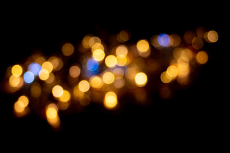 Perfect yellow and blue bokeh for a festive background. De-focused Abstract Light Circles. Bokeh is...