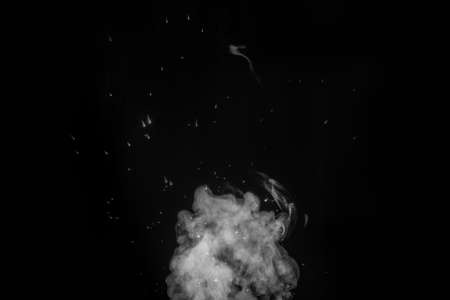 Curly white steam rising up and splashing water scattering in different directions isolated on a...