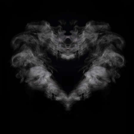 Steam or smoke in the shape of a mystical creature or in the shape of a heart on a black background, square frameの写真素材