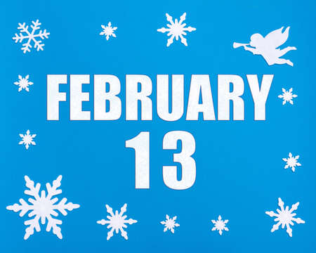 February 13th. Winter blue background with snowflakes, angel and a calendar date. Day 13 of month. Winter month, day of the year concept.の写真素材