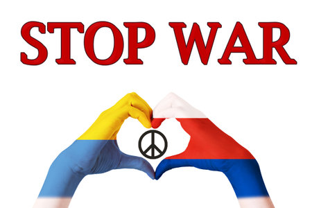 Hands painted in the colors of the flags of Russia and Ukraine showing the shape of a heart, a symbol of peaceの写真素材