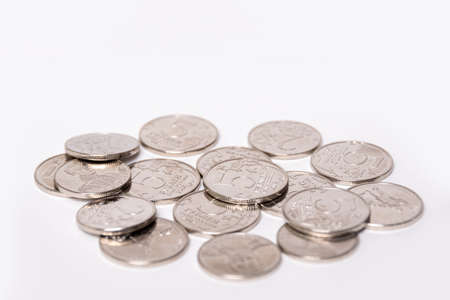Background of coins of Russian rubles in denominations of 2 rubles, 5 rubles, copy space. The ruble is the national currency of Russia. Money concept.の写真素材