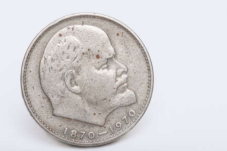 Obverse of a coin of the USSR with a portrait of the leader Lenin on a white background, close-up. Commemorative coin 1 ruble issued for the 100th anniversary of the birth of Vladimir Ulyanov.の写真素材