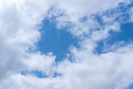 Dark blue evening sky with clouds. Blue hour. Heavenly natural background to overlay on your photos.の写真素材