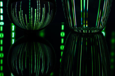 Dark background with computer binary code and a ball. The concept of artificial intelligence. Computer technology concepts, language matrix.の写真素材