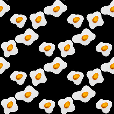 Creative layout made of scrambled eggs with decorated golden Easter eggs on a black background. Creative seamless pattern background. Spring holidays concept.の写真素材