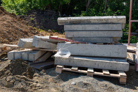 Concrete blocks for construction on wooden pallets. Storage cinder block. A construction site with...