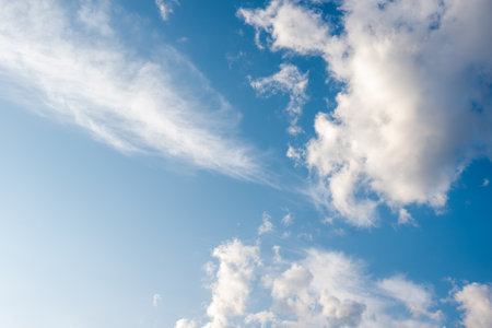 Unusual white striped wavy clouds in a bright blue sky. Heavenly background for your photos. Perfect Sky photo.の写真素材