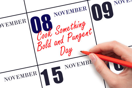 November 8. Hand writing text Cook Something Bold and Pungent Day on calendar date. Save the date. Holiday. Important date. Day of the year concept.の写真素材