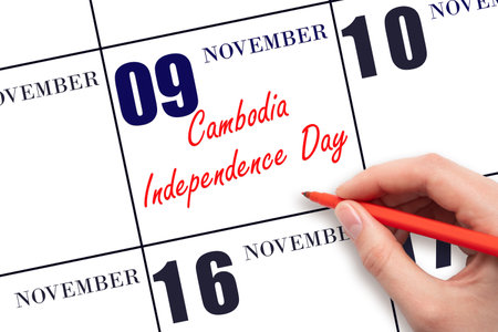 November 9. Hand writing text Cambodia Independence Day on calendar date. Save the date. Holiday. Important date. Day of the year concept.の写真素材