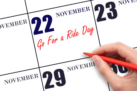 November 22. Hand writing text Go For a Ride Day on calendar date. Important date. Day of the year concept.の写真素材