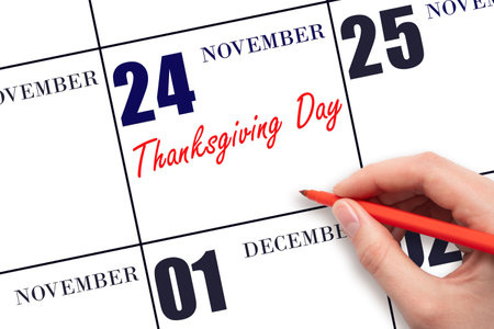 November 24. Hand writing text Thanksgiving Day on calendar date. Save the date. Holiday. Important date. Day of the year concept.の写真素材